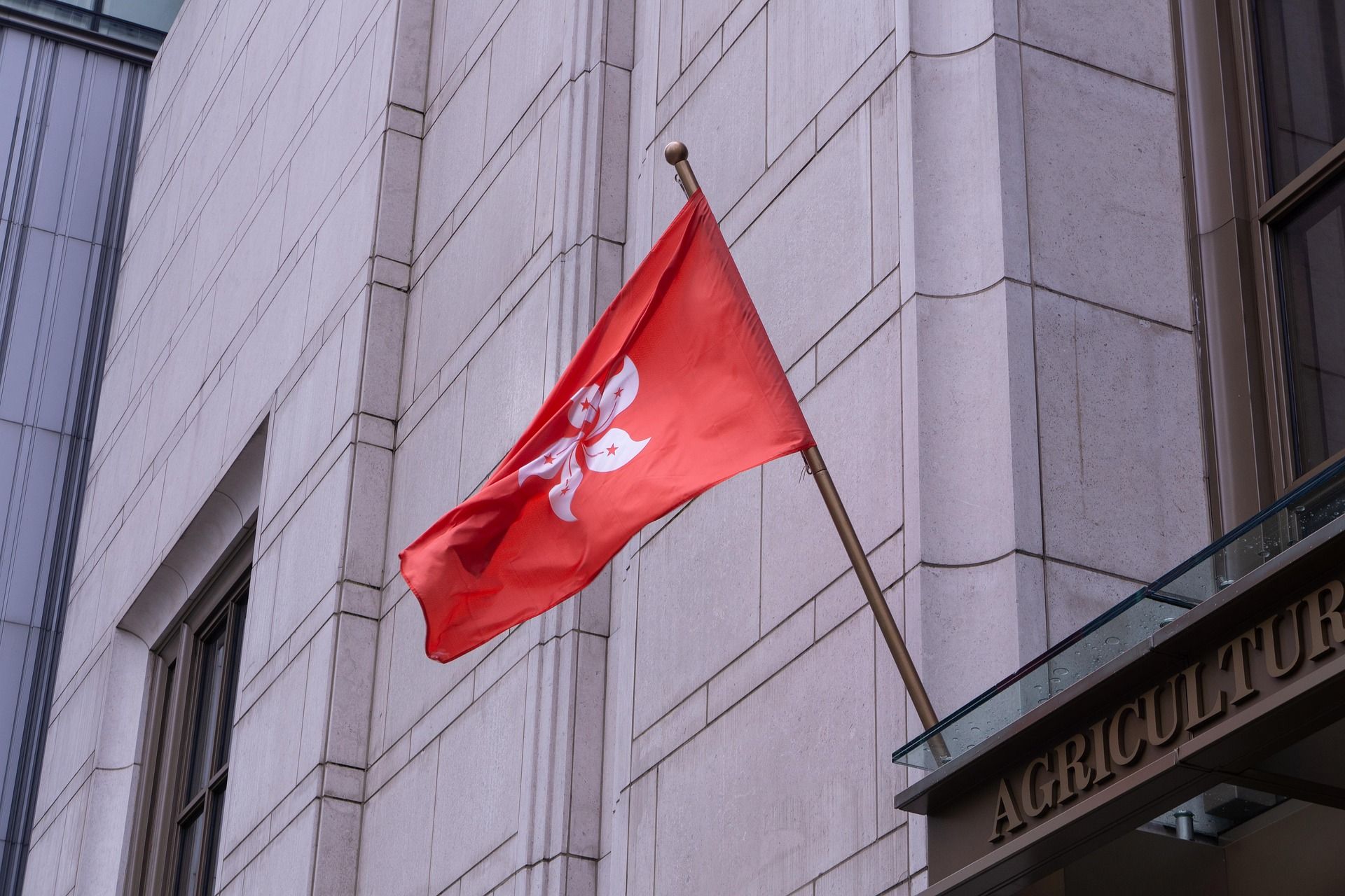 Hong Kong regional flag flying outside a government building