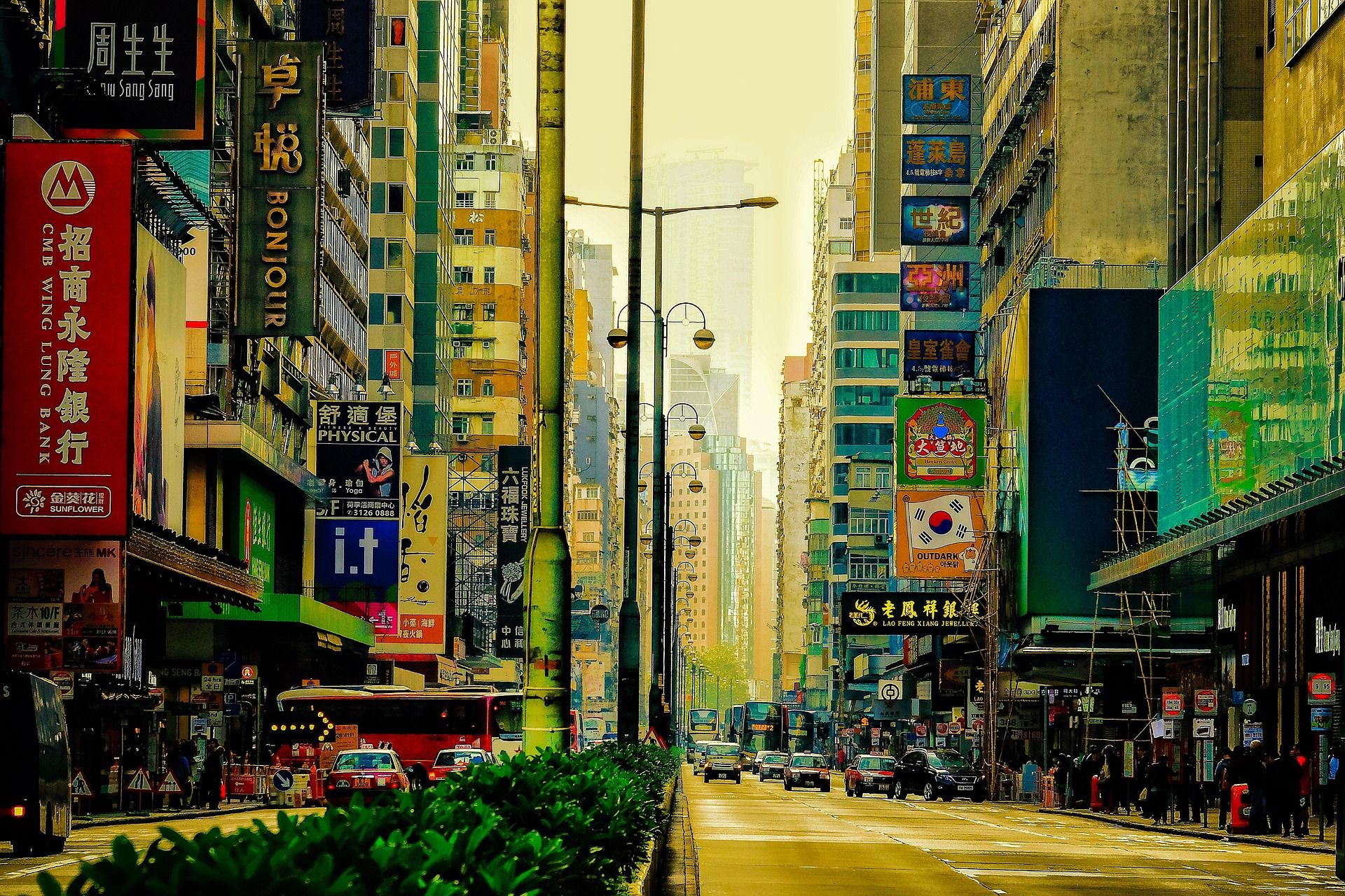 Busy Kowloon street lined with bank and shop signboards